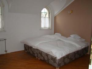 Postel nebo postele na pokoji v ubytování Guest House Zamak