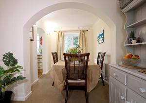 a dining room with a table and chairs at Comfy Quarters from 'TOBS Norwich' in Norwich