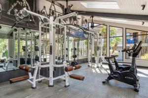 a gym with two treadmills and two exercise bikes at 3 Palms Tucson North Foothills in Tucson