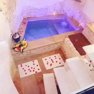 a pool with a deck of playing cards in it at Suite 800 in Ostuni