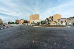 an empty street in a city with buildings at Modern studio near Metro Station in Senhora da Hora