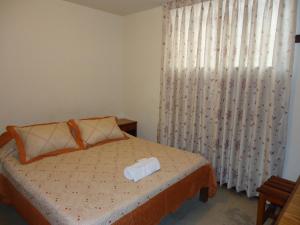 A bed or beds in a room at Hotel Estación Central