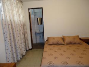 Ένα ή περισσότερα κρεβάτια σε δωμάτιο στο Hotel Estación Central