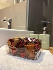 a plastic bag of food sitting on a bathroom sink at Hotel Eldorado in Tomice