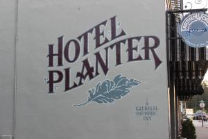 a sign on a building with the words lottery player at Hotel Planter in La Conner