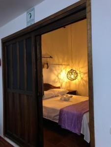 Ein Bett oder Betten in einem Zimmer der Unterkunft Rustico Hostel Barichara