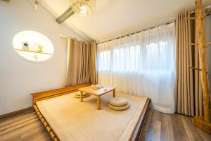 Vuode tai vuoteita majoituspaikassa 小喜屋（西湖街店）