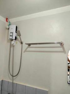 a shower in a bathroom with a shower at Cozy Staycation at Mandaue City in Mandaue City