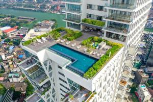 an aerial view of a building with a swimming pool at Altair Luxury Colombo by Miracle in Colombo