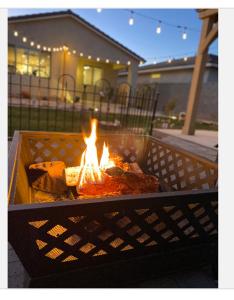 a fire pit in a grill in a yard at Deluxe king Prívate Suite in Litchfield Park
