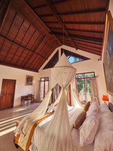 Postel nebo postele na pokoji v ubytování Portobello Villa Ubud