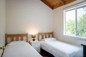 Ένα ή περισσότερα κρεβάτια σε δωμάτιο στο The Sleeping Lady Private Retreat