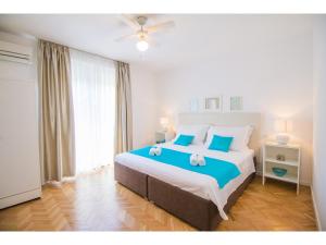 En eller flere senge i et værelse på Residenza Apartments