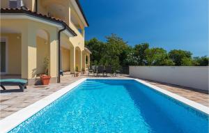 a swimming pool in front of a house at Villa Florami in Pula +45 photos