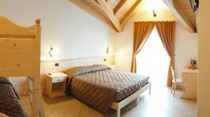 A bed or beds in a room at Bellaguarda ROOMS 10min da Tirano