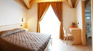 A bed or beds in a room at Bellaguarda ROOMS 10min da Tirano