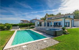 a swimming pool in the yard of a house at Villa Edoardo in Vižinada +51 photos