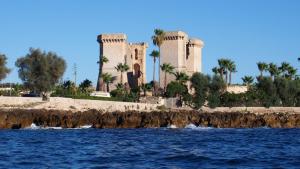 a view of a castle from the water at B&B L'Angolo in Sannicola