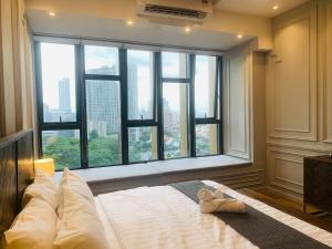 Postel nebo postele na pokoji v ubytování Ceylonz Suites by ROOMY