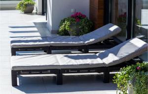 two beds sitting on a porch with plants at Villa Bianca in Zadar +21 photos