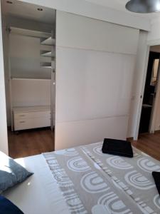 a bedroom with a bed and a closet at Home & Away in Palma de Mallorca