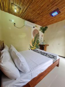 Postel nebo postele na pokoji v ubytování Tinipak Lodge