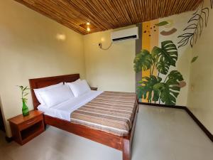 Postel nebo postele na pokoji v ubytování Tinipak Lodge