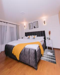 a bedroom with a large bed with a large bedskirts at Ruaka Radiance 2-Bed Escape in Ruaka