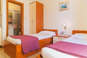 Posteľ alebo postele v izbe v ubytovaní Villa Spalatina