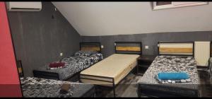 a room with three beds in a room at Kiev hostel in Tbilisi City