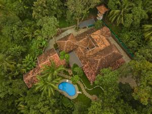 an overhead view of a house with a swimming pool at Malabar Kovilakam in Malappuram