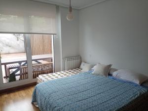 Postel nebo postele na pokoji v ubytování Apartamento con terraza