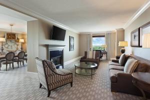 a living room with a couch and a fireplace at Spartanburg Marriott in Spartanburg