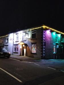 a lit up building on a street at night at THE NEW INN Newton Derbyshire in Tibshelf