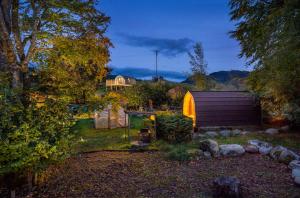 a backyard with a shed and a garden at Glentruim Lodge Ecopod in Newtonmore