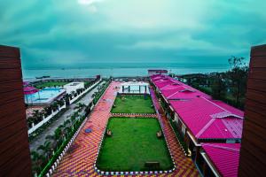 an overhead view of a resort with red roofs at Prasant Beach Resort in Mandarmoni