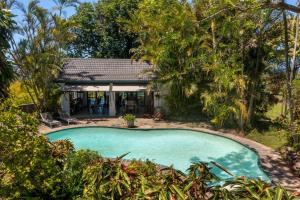 an image of a swimming pool in front of a house at Seaforth Country House in Ballito