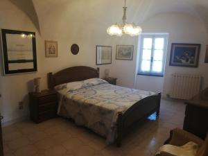 A bed or beds in a room at A ca' du Risso - Appartamento - Sea & outdoor for families, bikers and climbers