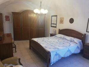 A bed or beds in a room at A ca' du Risso - Appartamento - Sea & outdoor for families, bikers and climbers