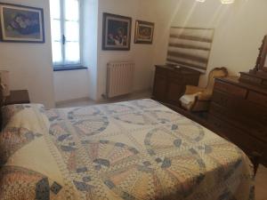 A bed or beds in a room at A ca' du Risso - Appartamento - Sea & outdoor for families, bikers and climbers
