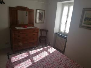 A bed or beds in a room at A ca' du Risso - Appartamento - Sea & outdoor for families, bikers and climbers