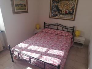 A bed or beds in a room at A ca' du Risso - Appartamento - Sea & outdoor for families, bikers and climbers