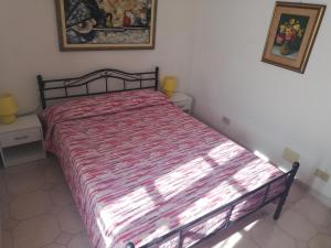 A bed or beds in a room at A ca' du Risso - Appartamento - Sea & outdoor for families, bikers and climbers