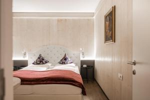 Postel nebo postele na pokoji v ubytování myLoisl Apartments