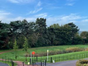 a park with a playground in the middle of a field at Rose Cottage 