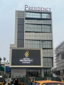 a building with a hotel emergency sign on it at PRESIDENCY AIRPORT HOTEL in Cochin