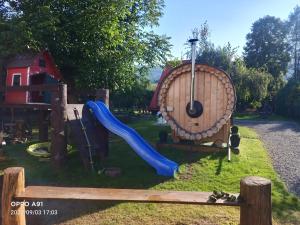 a playground with a slide at Magiczny Dom w Brennej in Brenna