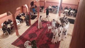 a group of people in a room with a wedding party at Camping , Maison d'hôte Bivouac hyatt-tata in Tatta