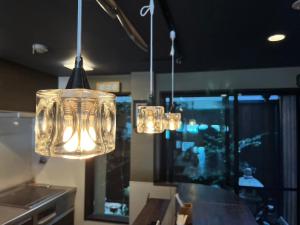 two chandeliers hanging from the ceiling in a kitchen at Eiki in Kyoto