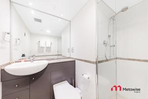 a bathroom with a sink and a shower at MetaWise Sydney CBD Haymarket 2Bed Apartment 1506 in Sydney